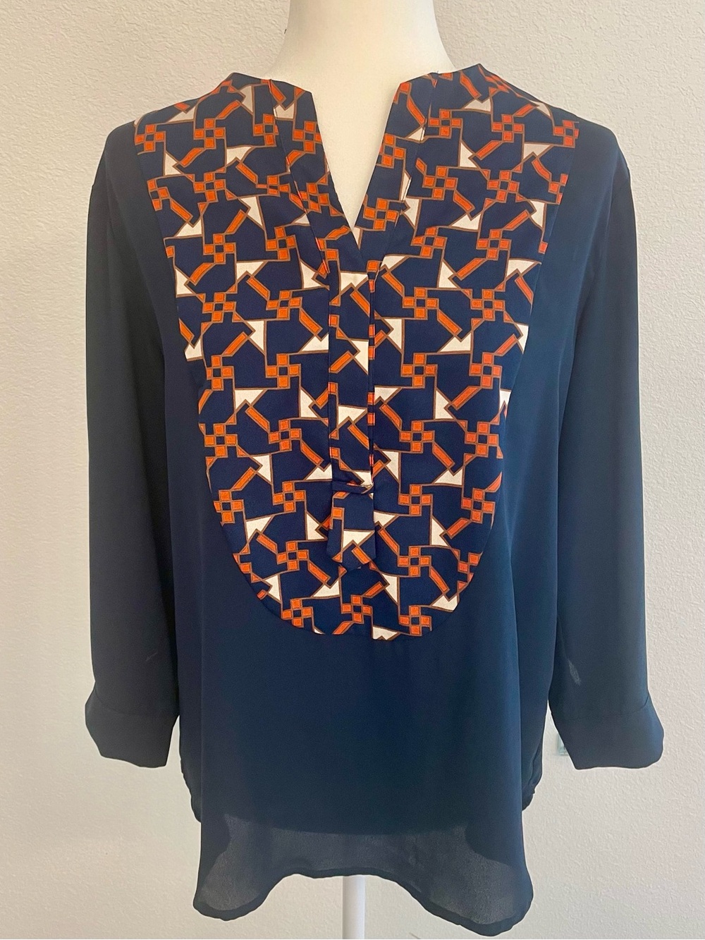 Collective Concepts Navy Blouse with Orange & Cream Geometric Bib